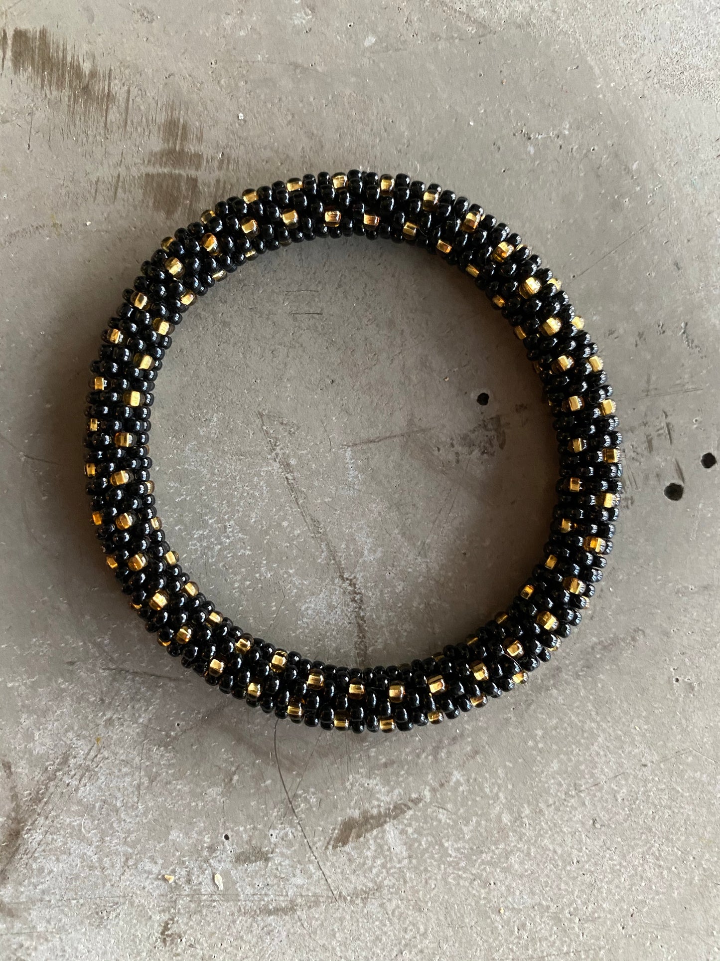 BLACK GOLD STAR BRACELET